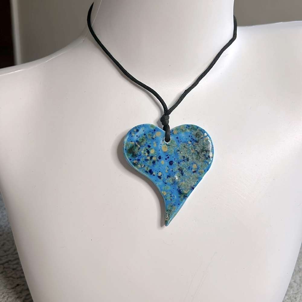 Handmade Ceramic heart with leather cord.